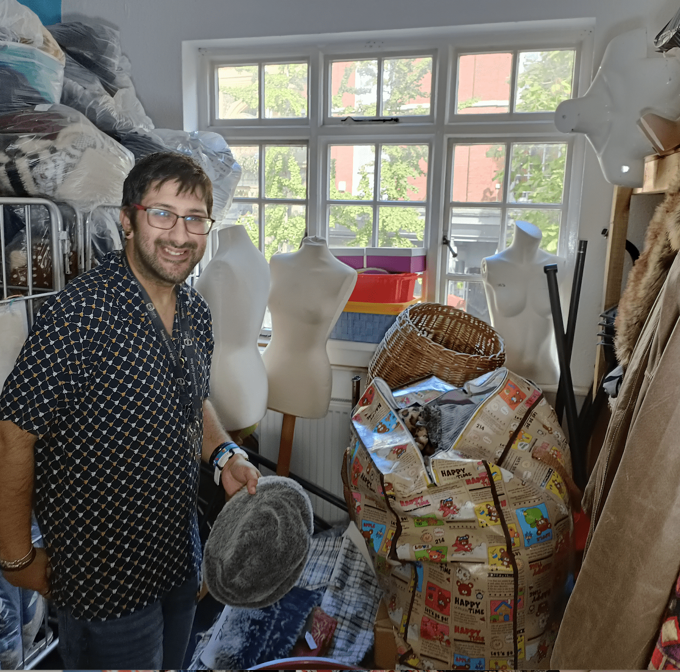 Charity shop stock room and volunteer