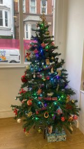 Photo shows the My Sight Notts Christmas Tree trimmed with lights, tinsel and baubles and looking very festive!